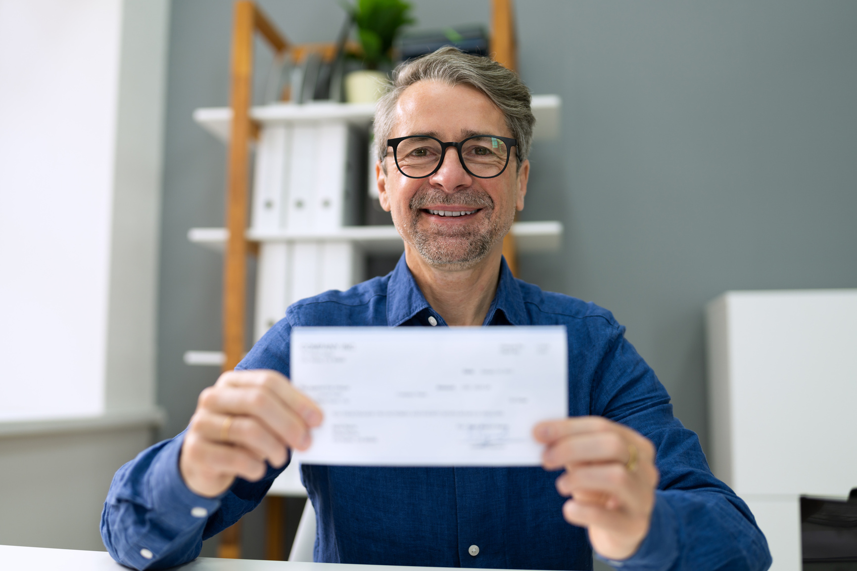 Holding Bank Payroll Check. Finance Cheque